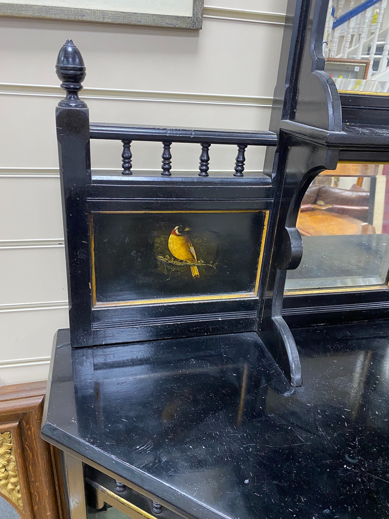 A late Victorian aesthetic movement ebonised and bird's eye maple mirror-back break front sideboard with inset painted panels of birds, width 106cm, depth 36cm, height 175cm